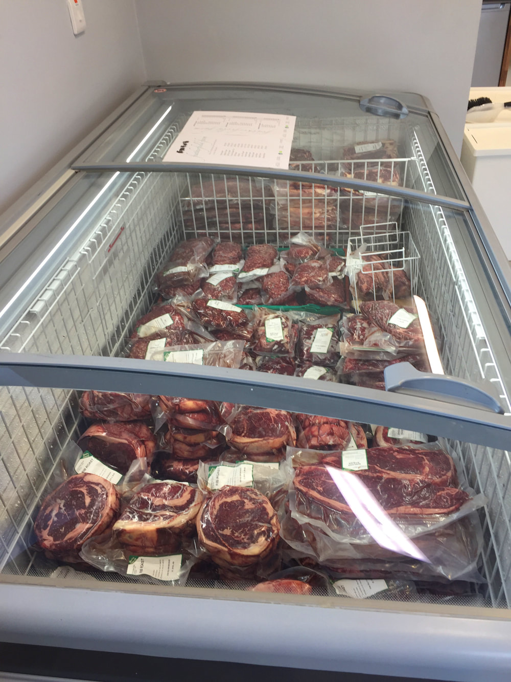 Picture frozen beef for sale in display freezer